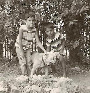 Raymond and younger brother John Ojeda with dog Max in back yard of house on Porter Street, San Antonio, TX in 1959